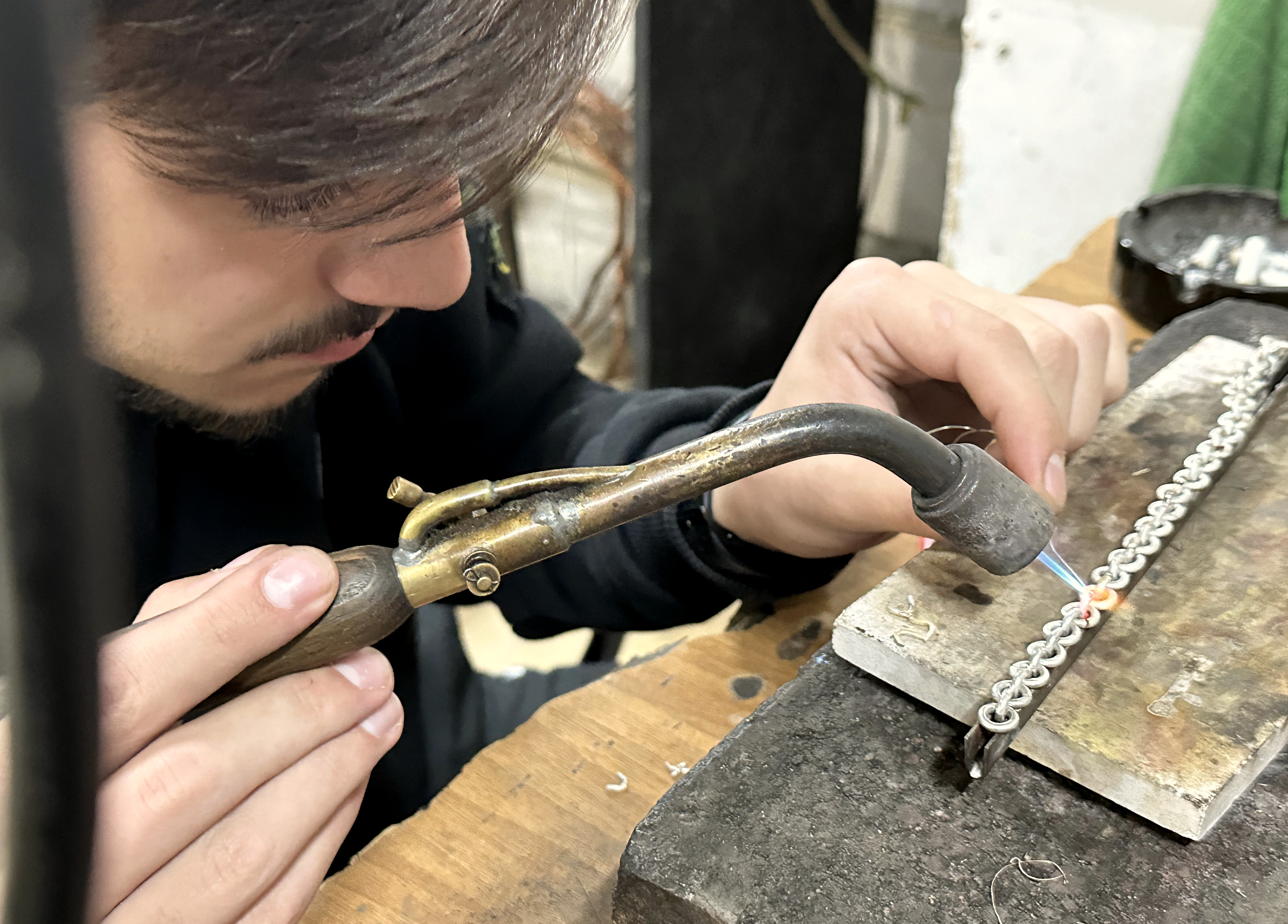 Jeweler working at a real bench